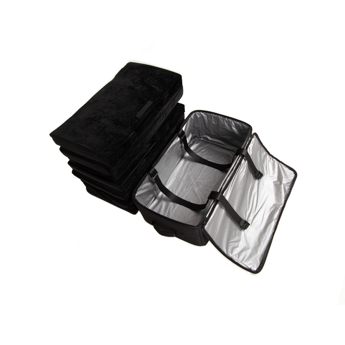 The folded black EV-MATS memory foam mattress next to its black carrying bag, which stands open to show the silver waterproof lining.