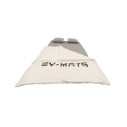 EV-MATS Basic CAMP SET for Tesla Model Y includes the Tesla mattress, the waterproof bag that fits in the back trunk of the Tesla Model Y, a sheet, a quilt, 2 pillows and a pillowcase